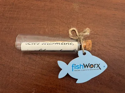 Bridges Day at the Races Its my promotional item for the guest swag bag Its a message in the bottle The message is Lets streamline simplify and scale Its a business card hang tag You guys did a great job  had help with measurements on my end so that also helped Loved that you punched out a hole for it to hang