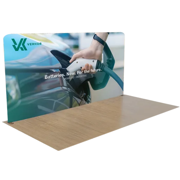 A trade show display features a large, tabletop-size rectangular banner with an image of a chameleon on a desert background.